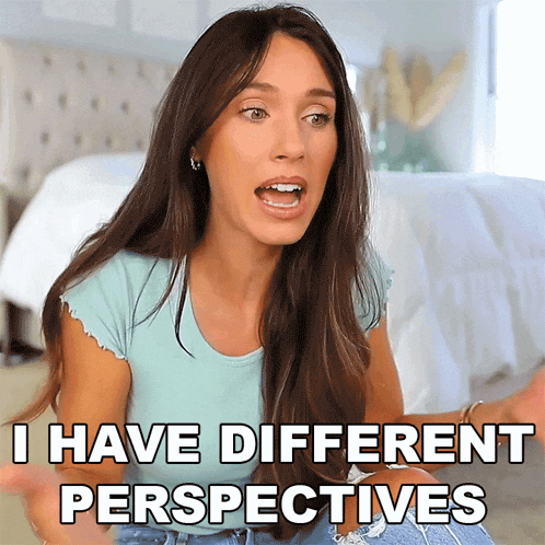 a woman says i have different perspectives while sitting on a bed