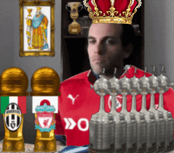 a man wearing a crown is surrounded by trophies including one for liverpool