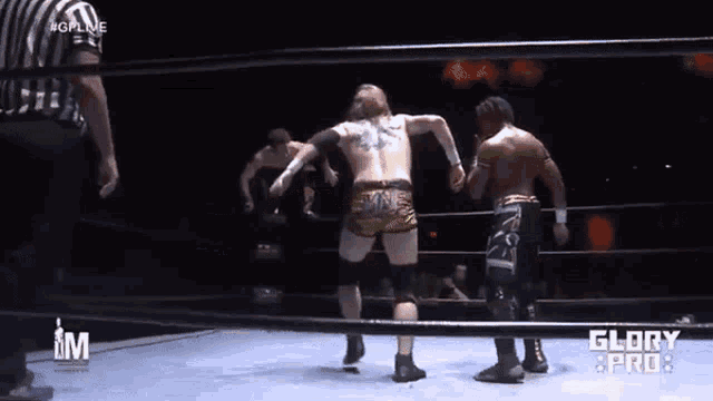 two wrestlers in a ring with the word glory on the bottom
