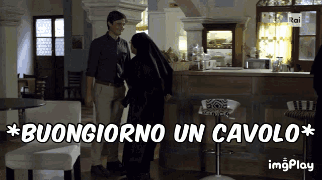 a man and a nun are standing in a room with the words buongiorno un cavolo above them
