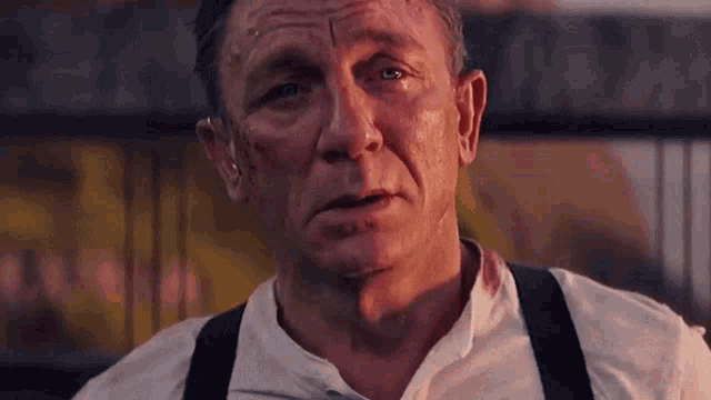 a close up of a man 's face with a bloody neck