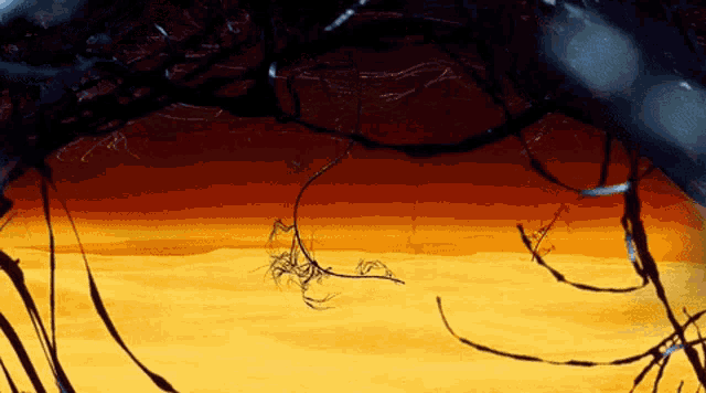 a painting of a sunset with a few branches in the foreground