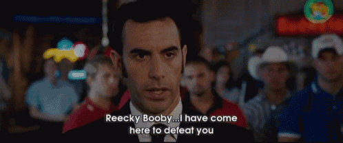 a man in a suit says reecky booby ... i have come here to defeat you