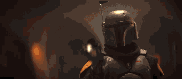 a man in a helmet is pointing a gun at the camera