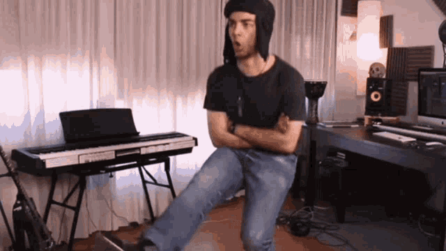 a man is standing in front of a piano keyboard