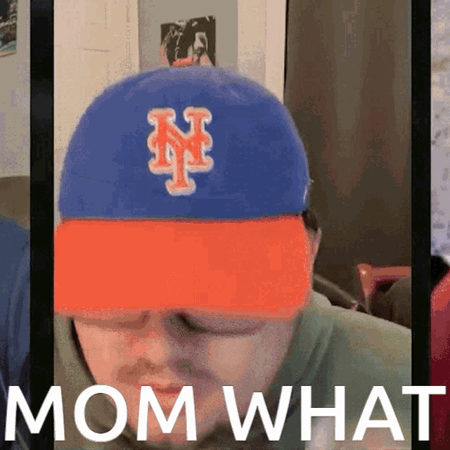 a man wearing a new york mets hat is asking mom what