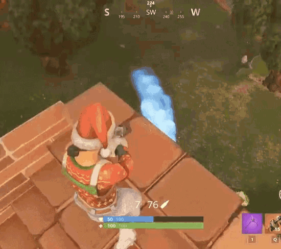a person in a santa hat is holding a gun in a game