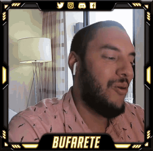 a man with a beard is wearing ear buds and has the name bufarete on the bottom