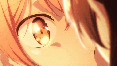 a close up of a person 's eye with a glowing pupil