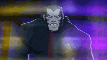 a man in a black jacket and red tie stands in a dark room