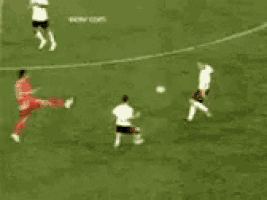 a group of soccer players are playing a game on a field .