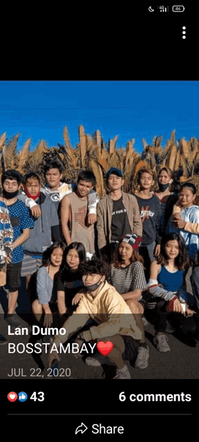 a group of people posing for a picture with the name lan dumo on the bottom