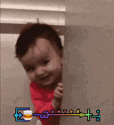 a baby in a red shirt with the word wanted on the bottom