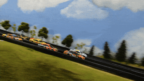 a race car with the word mil on the side is going down a track