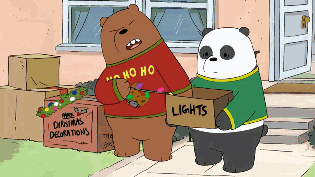 a couple of bears standing next to a box that says lights