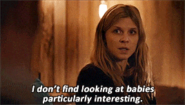 a woman in a dark room says " i don t find looking at babies particularly interesting "