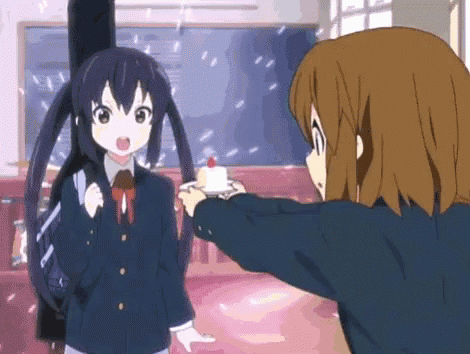 two anime girls are standing next to each other in a room .