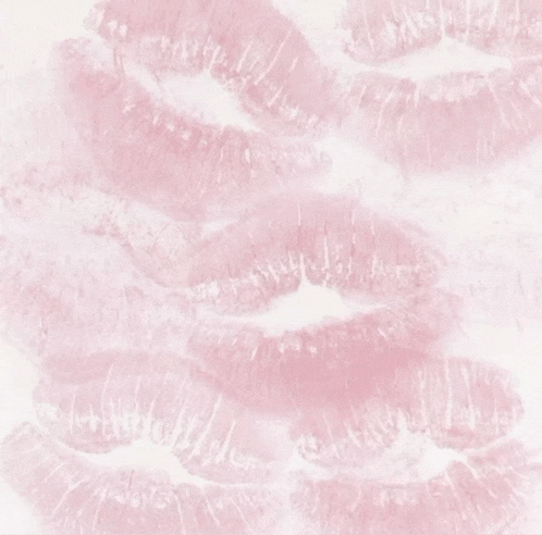 a close up of a row of pink lips on a white background .