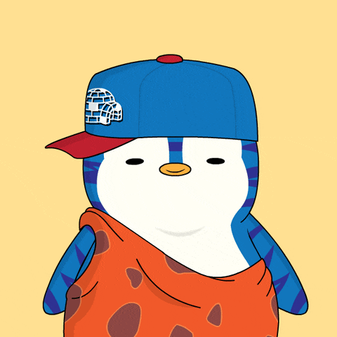 a penguin wearing a blue hat with an igloo on the front