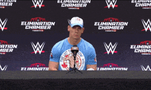 a man wearing a blue shirt that says " the last time is now "