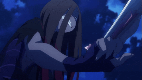 a person covering their face with their hands with a blue sky behind them