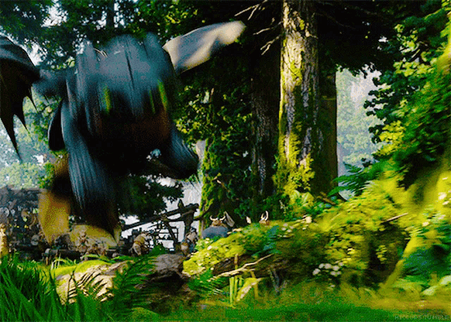 toothless from how to train your dragon is flying through the air in the woods