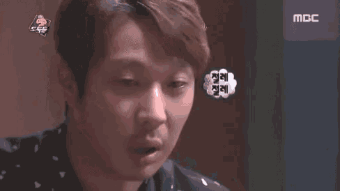a close up of a man 's face with a speech bubble that says ' mbc ' on it