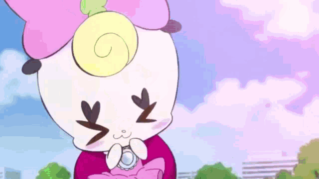 a cartoon character with a flower on her head is holding a watch in her hand .