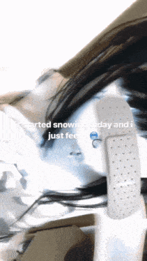 a blurred image of a person with a bandage on their arm that says i started snowing today