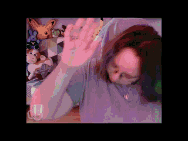 a pixelated image of a person laying on a bed