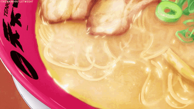 a close up of a bowl of ramen that says tenma on the side