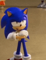 a close up of a sonic the hedgehog toy standing on a floor .