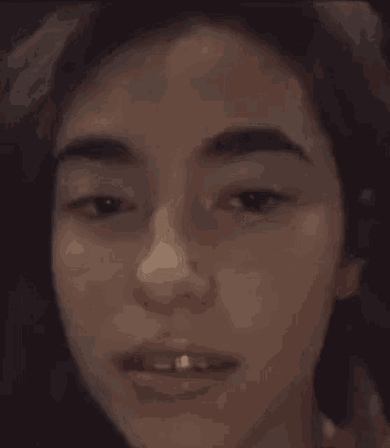 a close up of a woman making a funny face