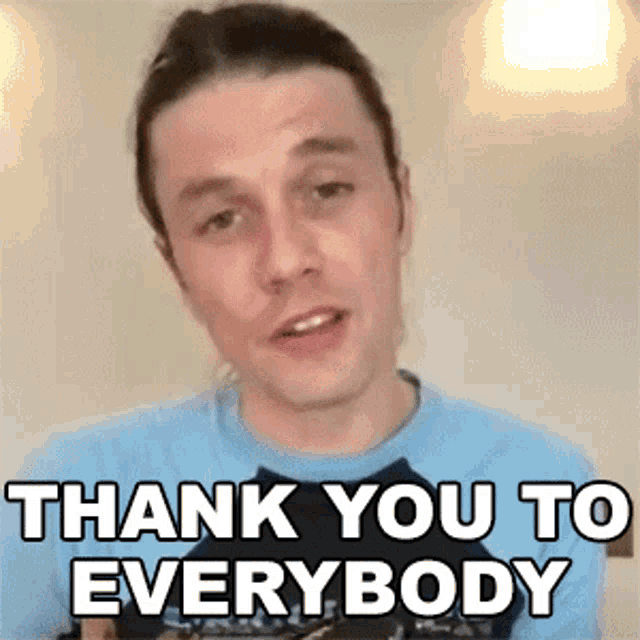 a man in a blue shirt is giving a thank you to everybody message .