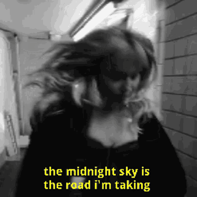 a black and white photo of a woman with a quote that says the midnight sky is the road i 'm taking
