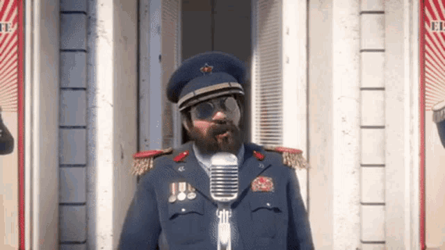 a man in a military uniform is singing into a microphone while wearing sunglasses .