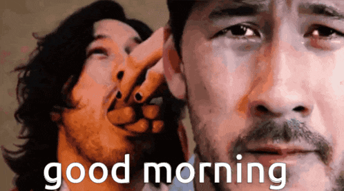 a man with a beard is being touched by another man 's hand and the words good morning are visible