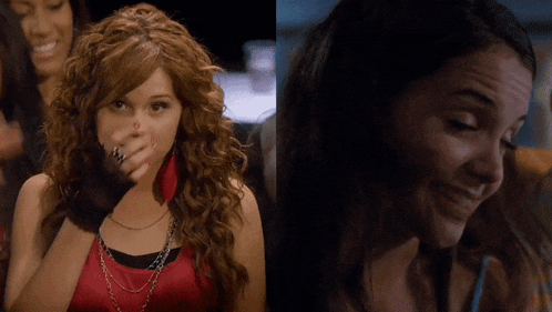 a woman with red nails is covering her face with her hand and another woman is smiling