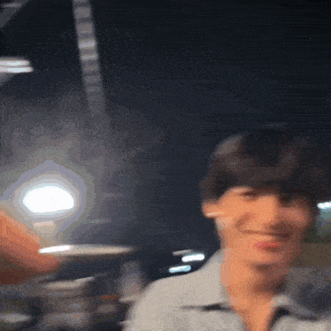 a blurry picture of a person 's face with a light in the background