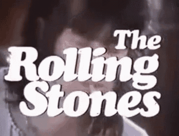 a man is smoking a cigarette in front of a sign that says the rolling stones