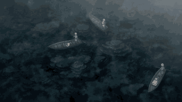 a group of boats are floating in the water and one of the boats has a person in it