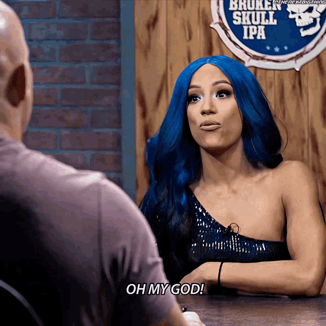 a woman with blue hair is talking to a bald man in front of a sign that says broken skull ipa