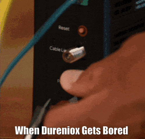 a person pressing a button on a device with the words when dureniox gets bored