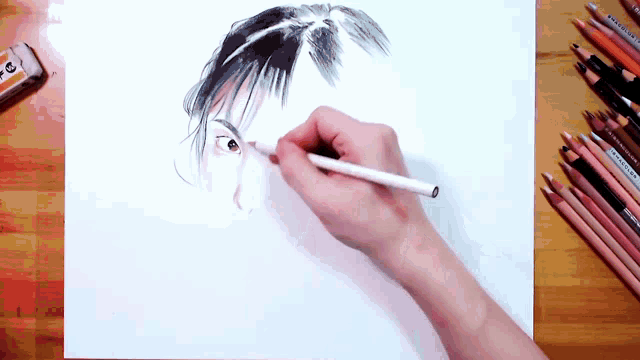 a person is drawing a woman 's face with a pencil on a piece of paper
