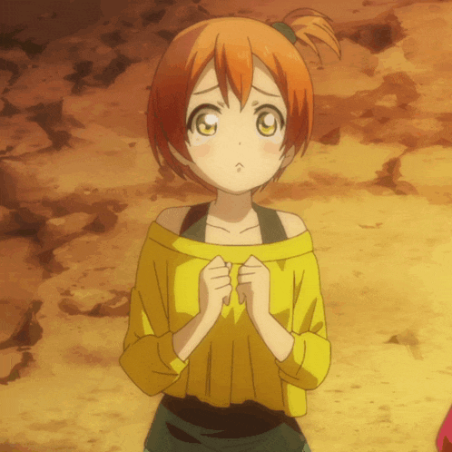 a girl with orange hair and yellow eyes is wearing a yellow sweater