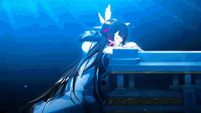 a girl with long black hair is sitting at a piano in the water .