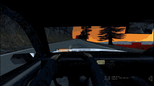 a computer screen shows a sunset with a few trees in the distance