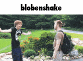 two men are standing next to each other in a park and the word blobenshake is above them