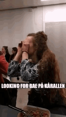 a woman covering her face with her hands and a caption that says looking for bae pa karallen