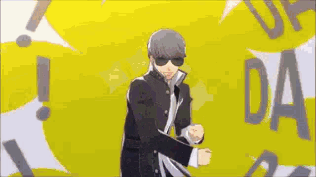 a man wearing sunglasses is standing in front of a yellow background .